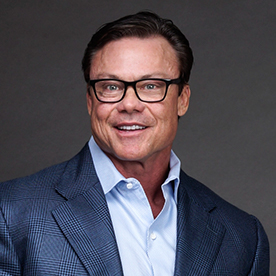 Reagan Lancaster — executive professional headshot blue blazer